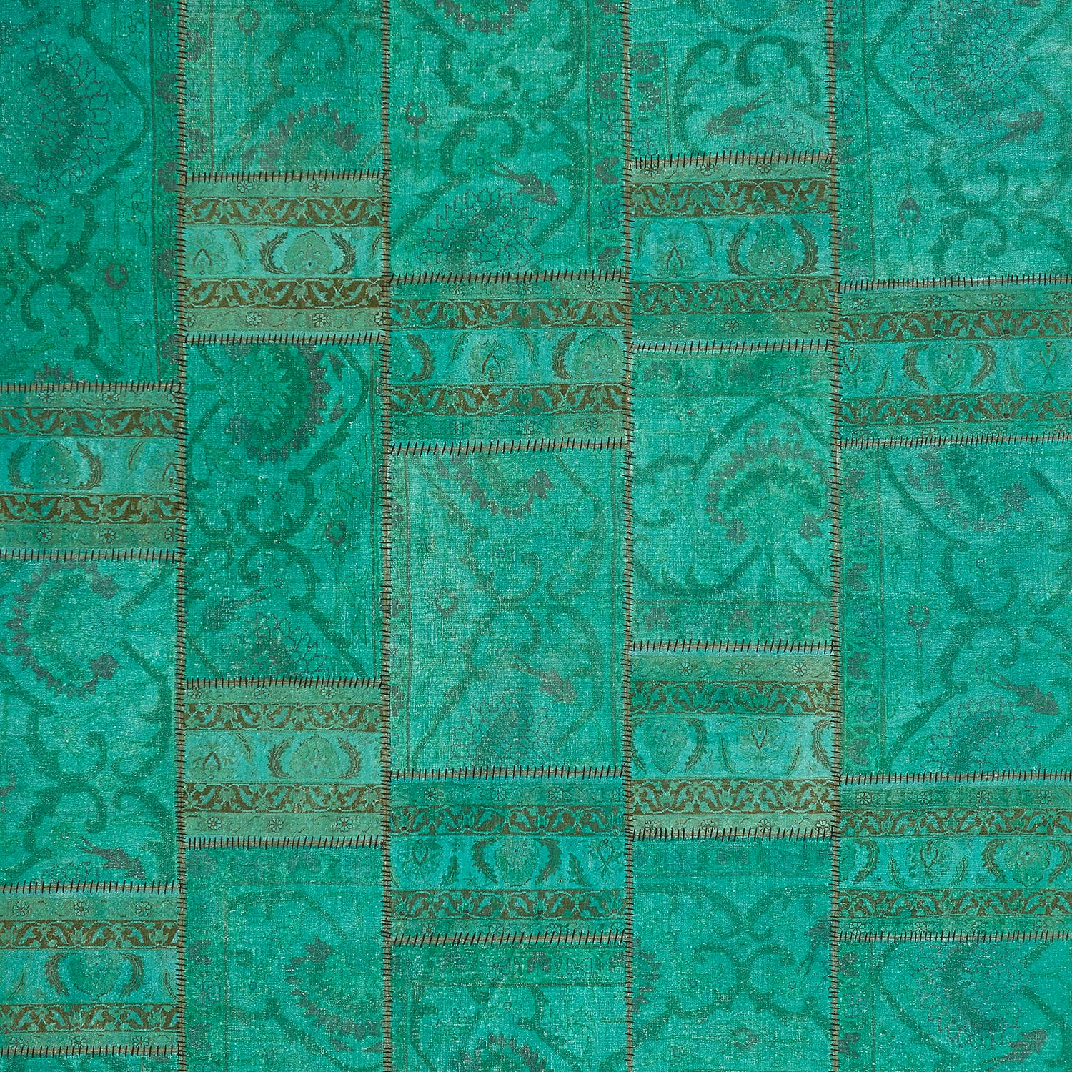 Elegant teal textile with ornate patterns and vintage aesthetic.
