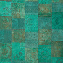 Vibrant turquoise and green patchwork textile with intricate floral designs.