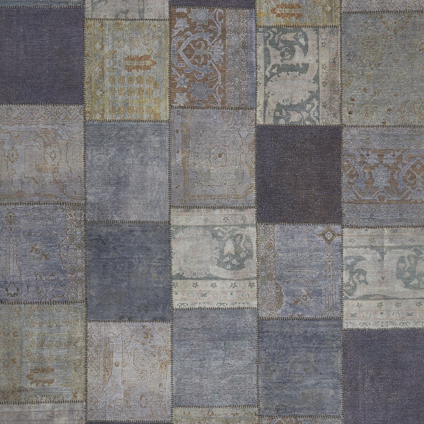 Eclectic patchwork rug with various blue shades and distinctive patterns.