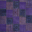 Vintage-inspired patchwork textile in shades of purple with intricate patterns