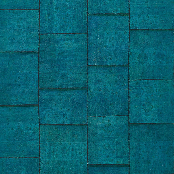 Close-up of decorative blue textured surface resembling floral fabric pattern.