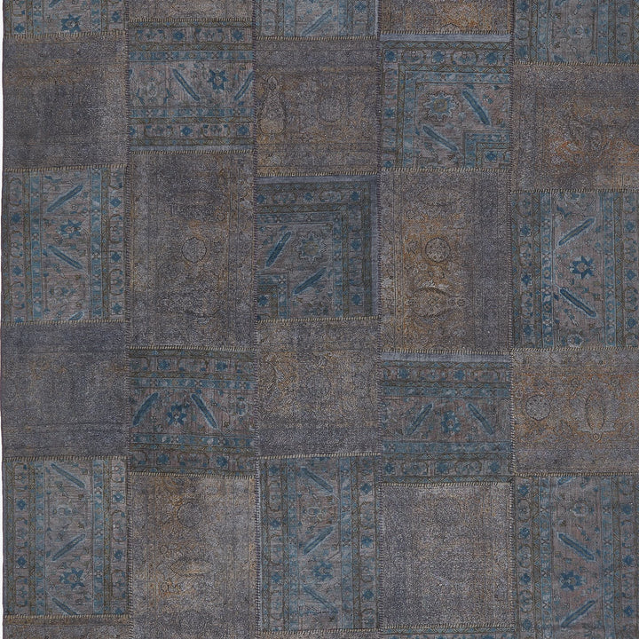 Antique-inspired woven carpet with intricate designs and faded colors.
