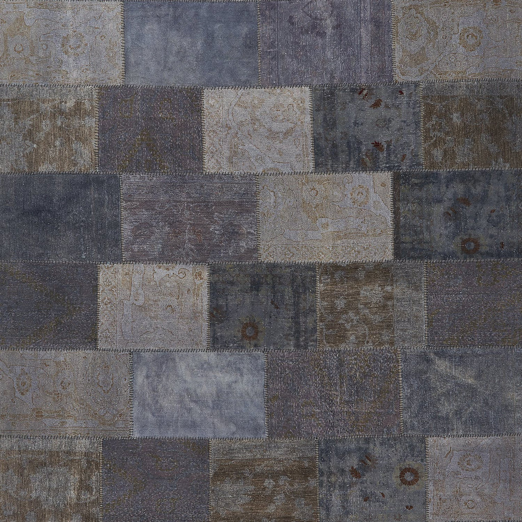 Patchwork quilt showcasing intricate vintage fabrics in a checkerboard pattern.