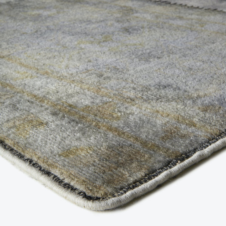 Close-up of a luxurious, textured rug with a stone-like pattern.