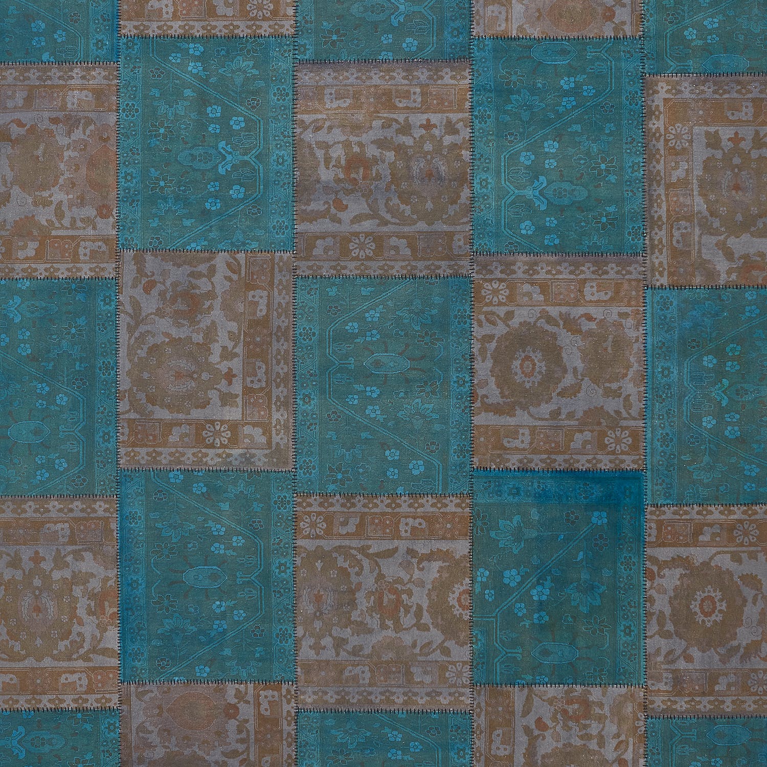 Vintage-inspired patchwork of teal and brown fabric squares with intricate patterns.