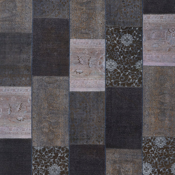 Vintage-inspired patchwork textile with diverse patterns in cool tones.