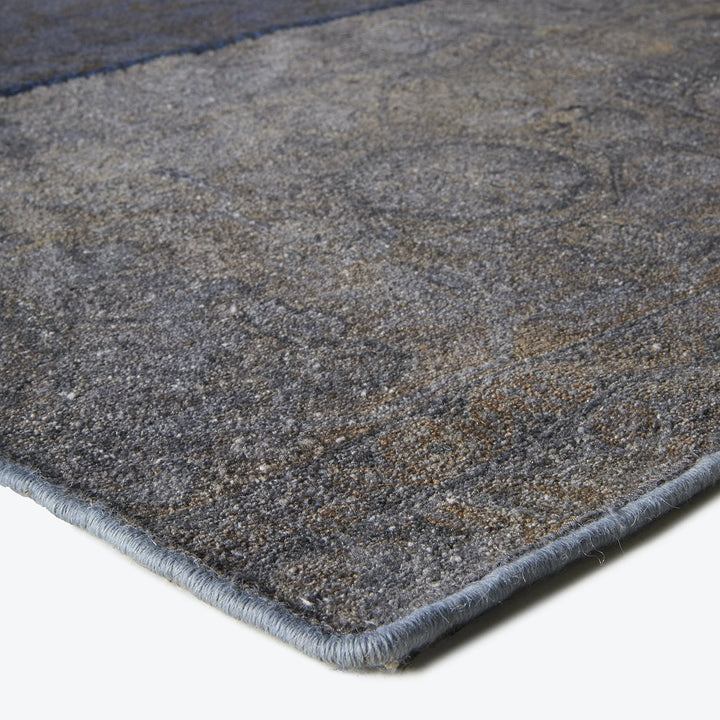 Close-up of a plush gray rug with textured fibers.