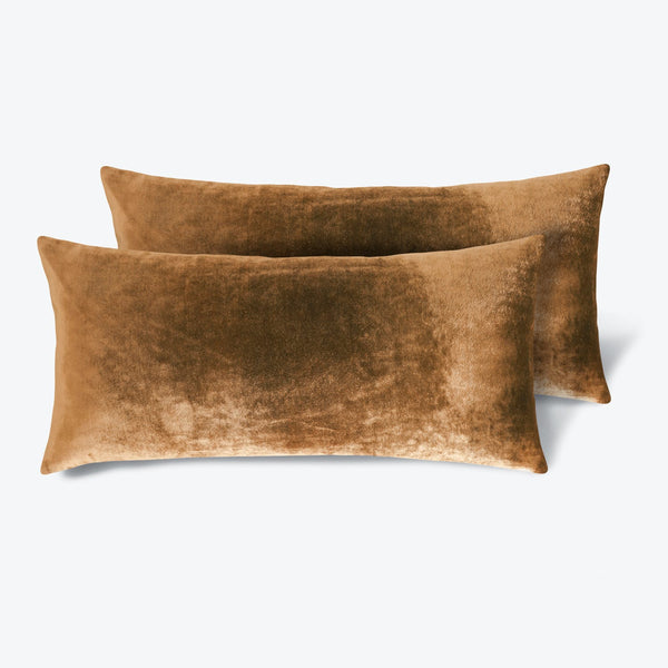 Rich caramel velvet pillows add luxurious comfort to any space.