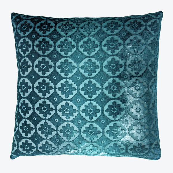 Square decorative cushion with intricate blue floral pattern and velvety texture.