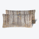 Soft and decorative rectangular throw pillow with muted plant design.