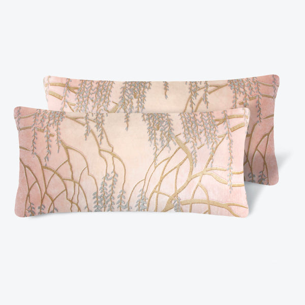 Delicate floral print fabric items with metallic detailing, displayed overlapping.