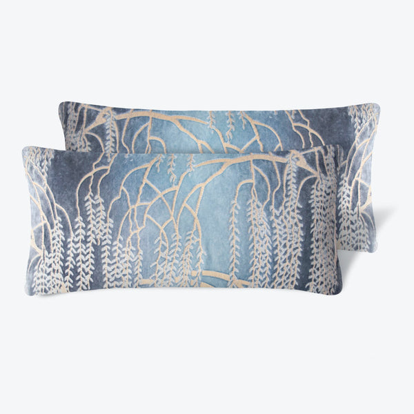 Two nature-inspired decorative pillows in serene blue tones.