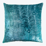 Square pillow with peacock feather pattern in rich teal hue.