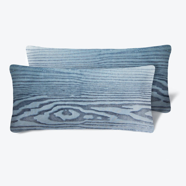 Two matching rectangular pillows with a soothing wood grain pattern.