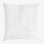 Square decorative pillow with chevron pattern adds depth to decor.