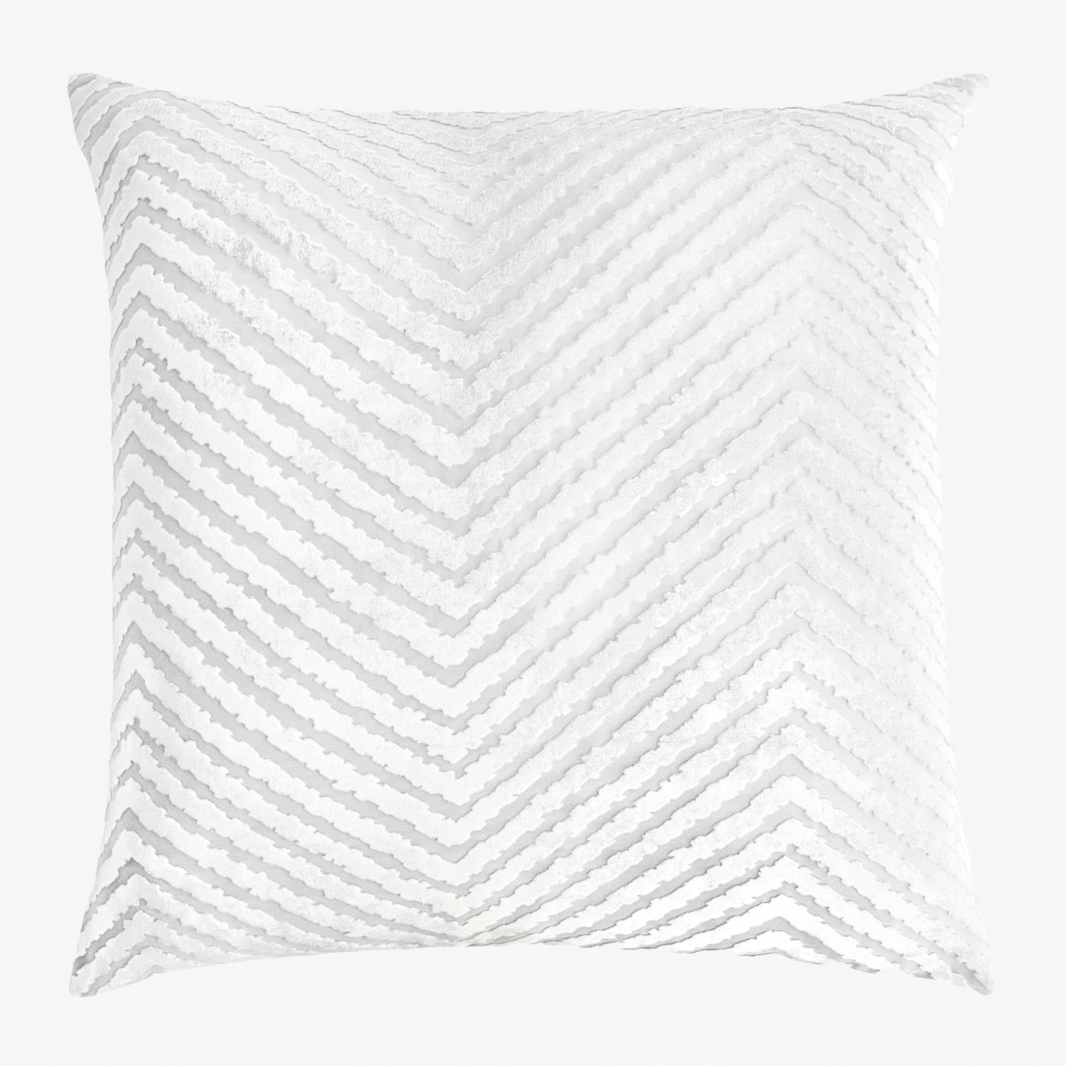 Square decorative pillow with chevron pattern adds depth to decor.
