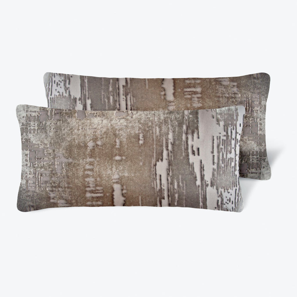 Two stylish rectangular pillows with abstract distressed pattern on white background.