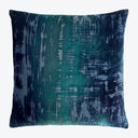 Square decorative pillow with abstract blue and green distressed print.