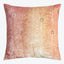 Square decorative pillow with botanical motif and peacock feather-like pattern in warm gradient tones.