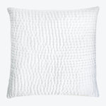 White decorative pillow with three-dimensional quilted pattern for home decor.