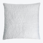 Fluffy white pillow with a quilted texture for ultimate comfort.