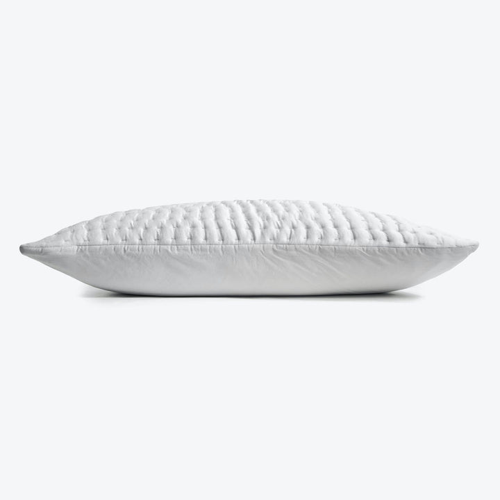 White quilted pillow with a plump and soft texture.