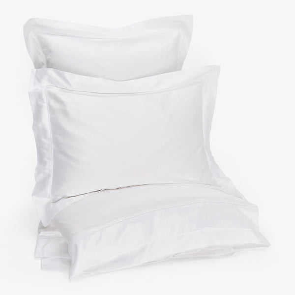 Minimalist white pillowcases with a smooth, simple design for advertising.