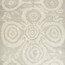Neutral-toned fabric or carpet with organic-inspired spiral motifs.