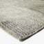 Close-up of a gray textured rug with a plush weave.