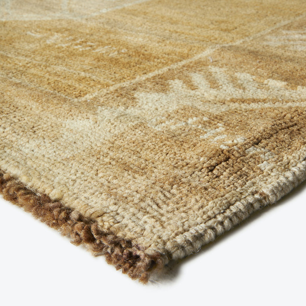 Close-up of a thick, soft textured rug with earthy tones.