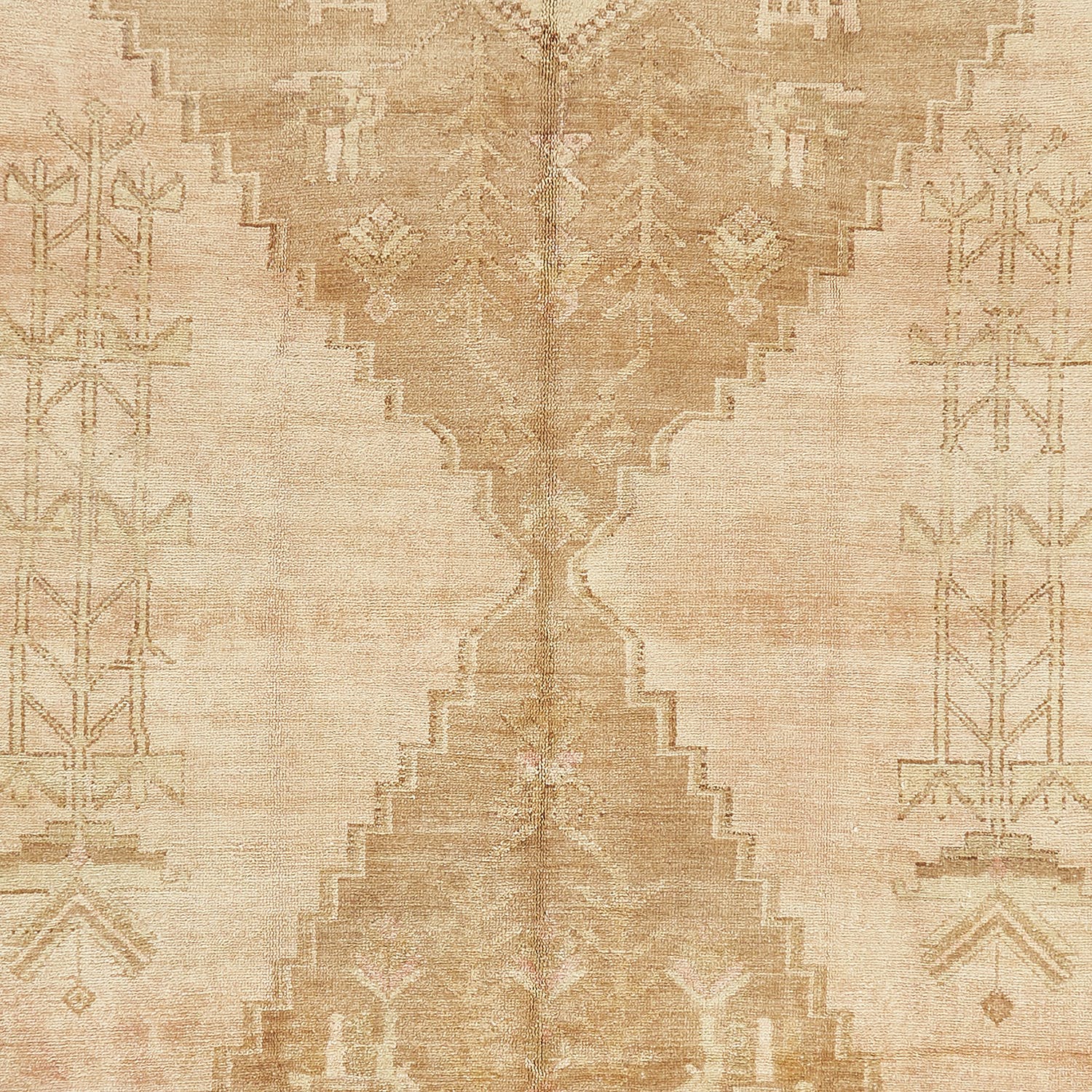 Vintage beige carpet with symmetrical Middle Eastern-inspired geometric patterns.