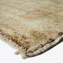 Close-up view of a textured carpet with gradient colors.