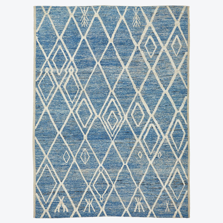 Rich blue rectangular rug with white diamond lattice pattern