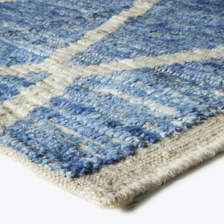 Close-up of a striped woolen fabric with fuzzy texture.