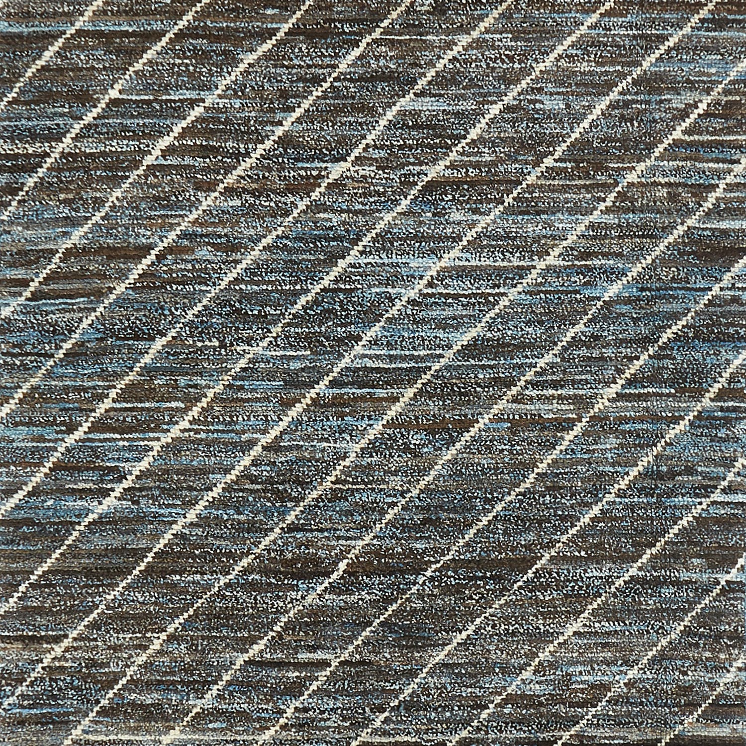 Patterned fabric with diagonal lines in brown, cream, and blue.