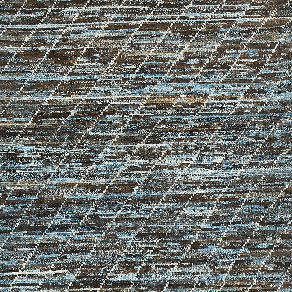 Abstract, organic pattern with mottled blend of blue, brown, and white.