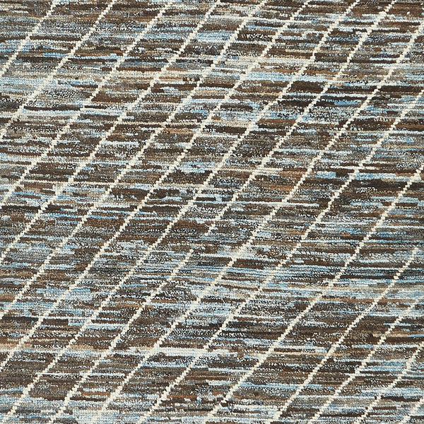 Close-up of coarse woven fabric with diagonal stripe herringbone pattern.