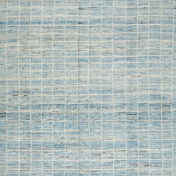 Textured grid pattern on faded blue background creates rustic feel.