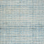 Textured grid pattern on faded blue background creates rustic feel.