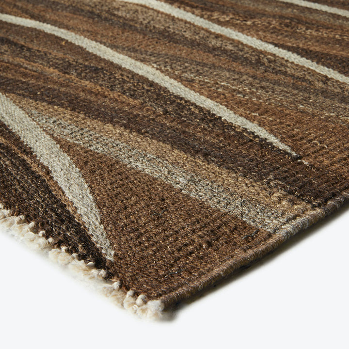 Close-up view of a rustic, striped fabric with thick texture.