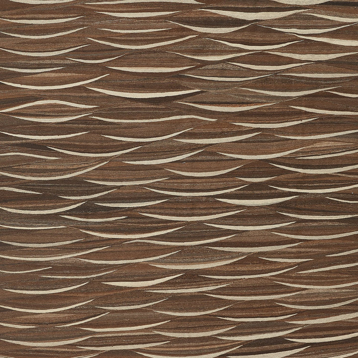 Close-up of a woven texture with a tactile, three-dimensional appearance.