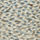 Abstract, mosaic-like pattern of irregular shapes in neutral tones.