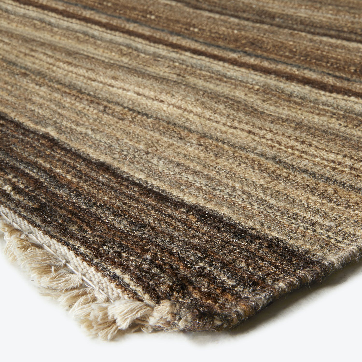 Close-up of a textured fabric with horizontal stripes and earthy tones.