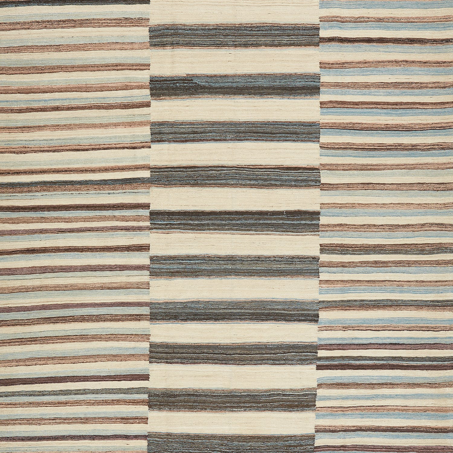 Close-up of a textured, striped pattern in earthy tones.