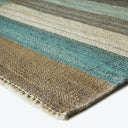 Close-up of a striped carpet with vibrant colors and texture.