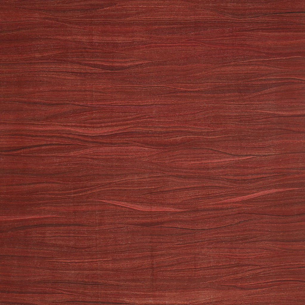 Close-up view of rich red wood texture with natural grain patterns.