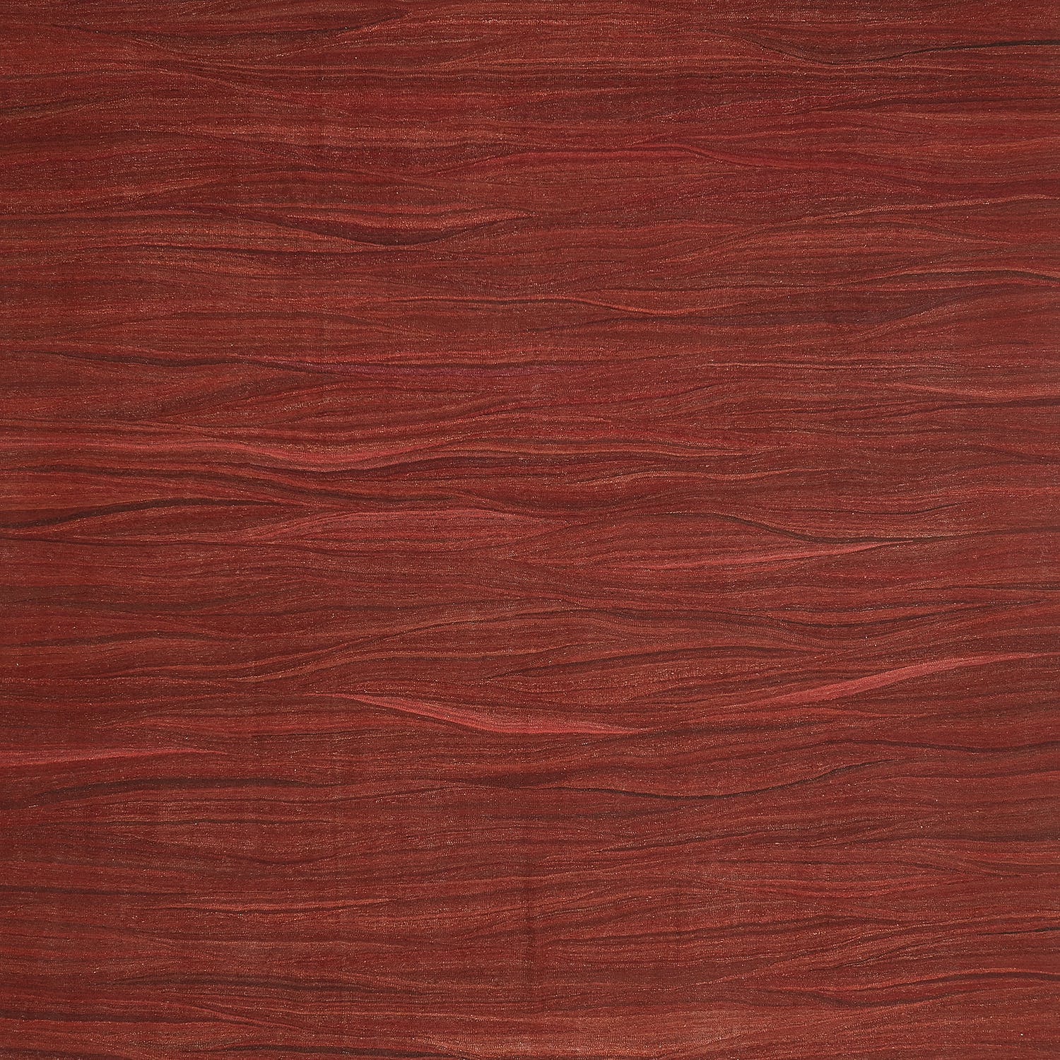 Close-up view of rich red wood texture with natural grain patterns.