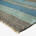 Close-up view of a striped woven rug showcasing vibrant colors.