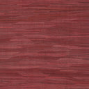 A close-up of a red wooden surface with distinct grain pattern.