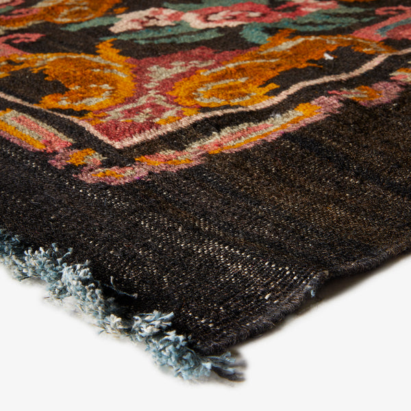 Vibrant and intricate traditional rug with thick plush pile texture.
